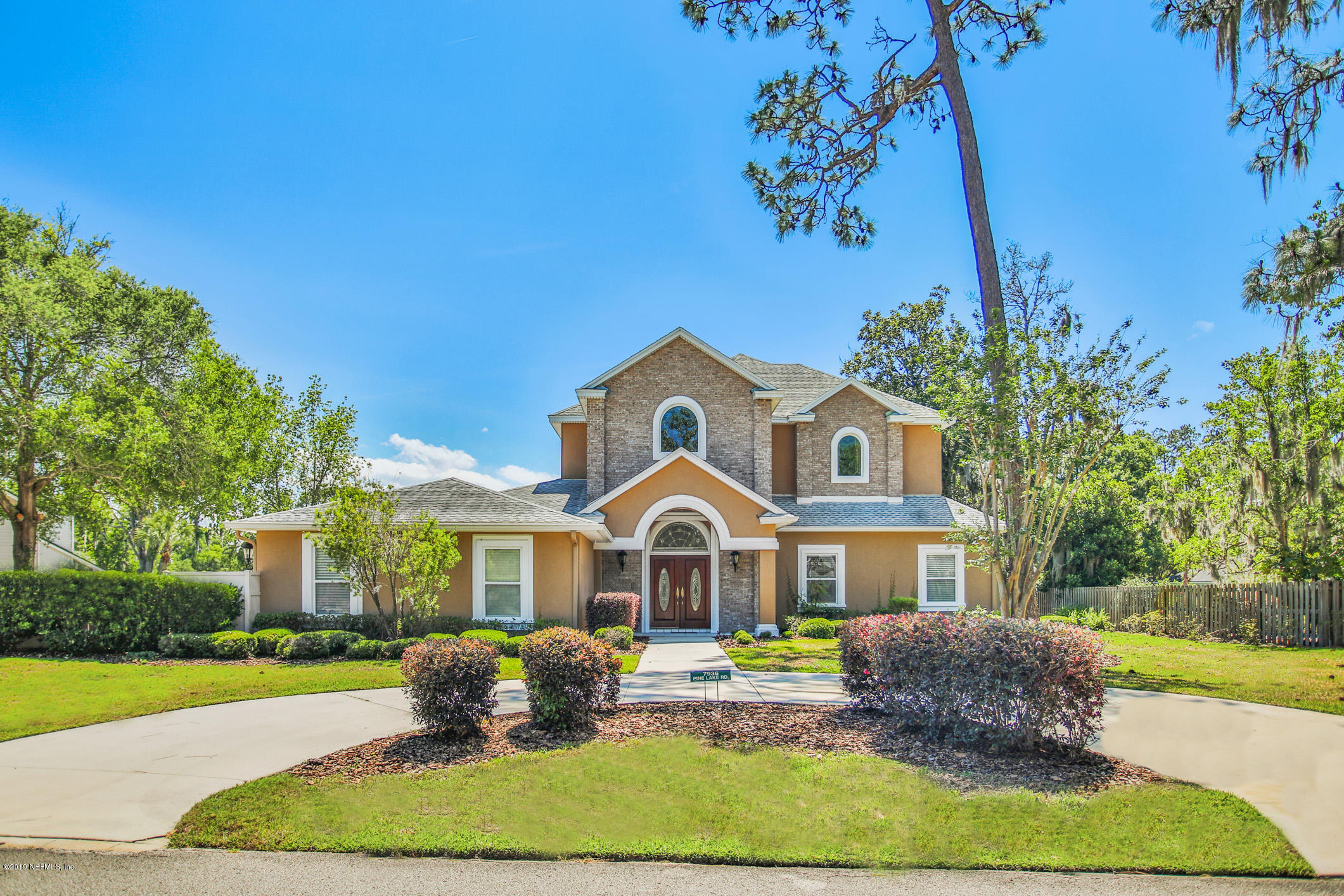 a front view of a house with a yard