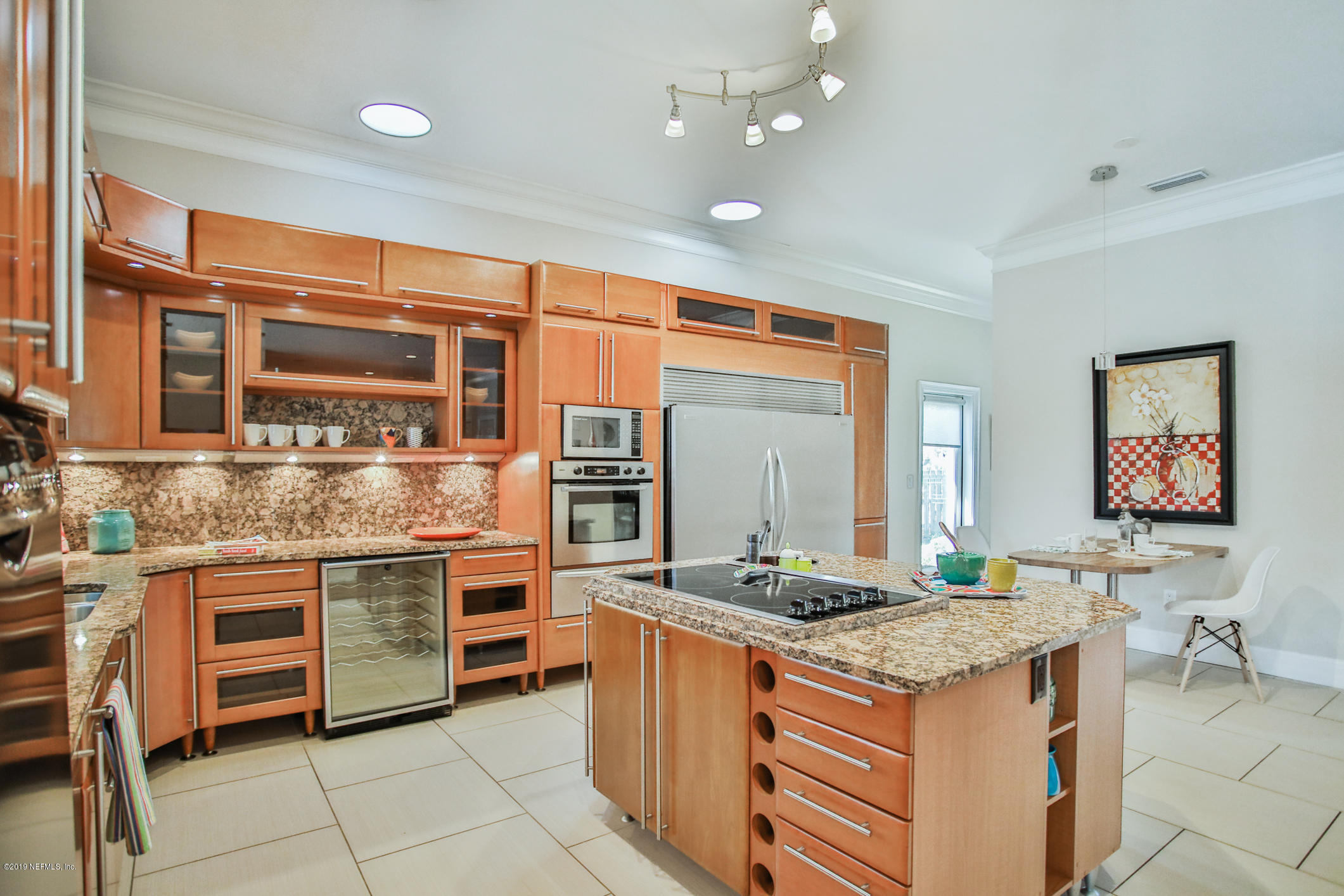 7936 Pine Lake Road Jacksonville, FL 32256 - Photo 23 of 70 a kitchen with stainless steel appliances granite countertop a stove and cabinets