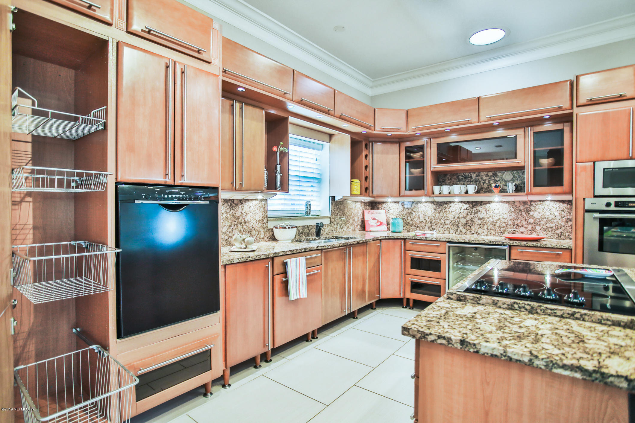 7936 Pine Lake Road Jacksonville, FL 32256 - Photo 26 of 70 a kitchen with stainless steel appliances granite countertop a stove and a sink