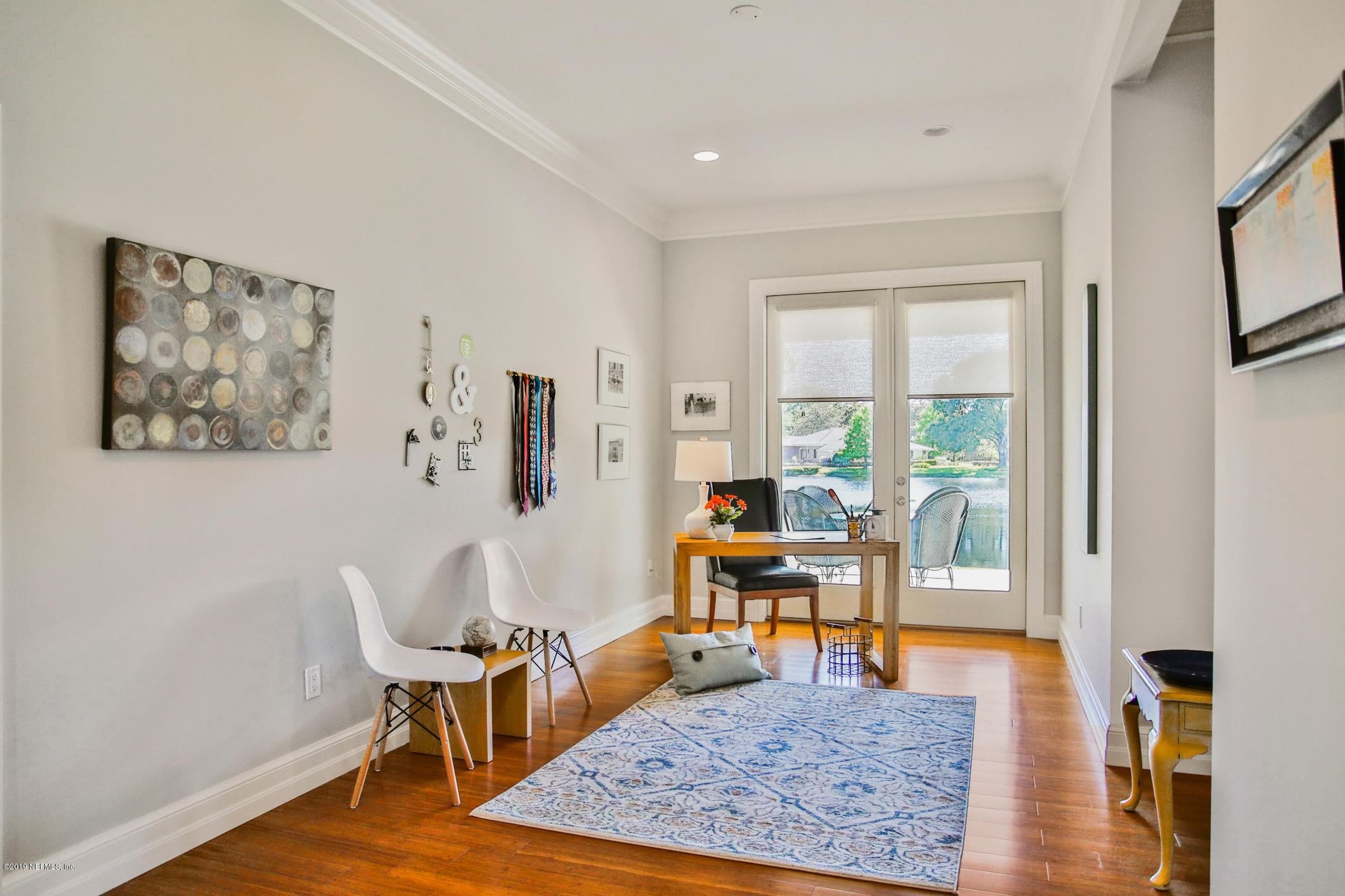 7936 Pine Lake Road Jacksonville, FL 32256 - Photo 33 of 70 a view of a livingroom with wooden floor and a rug