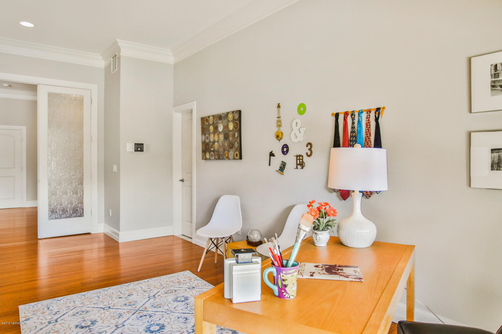 7936 Pine Lake Road Jacksonville, FL 32256 - Photo 35 of 70 a living room with furniture and a wooden floor