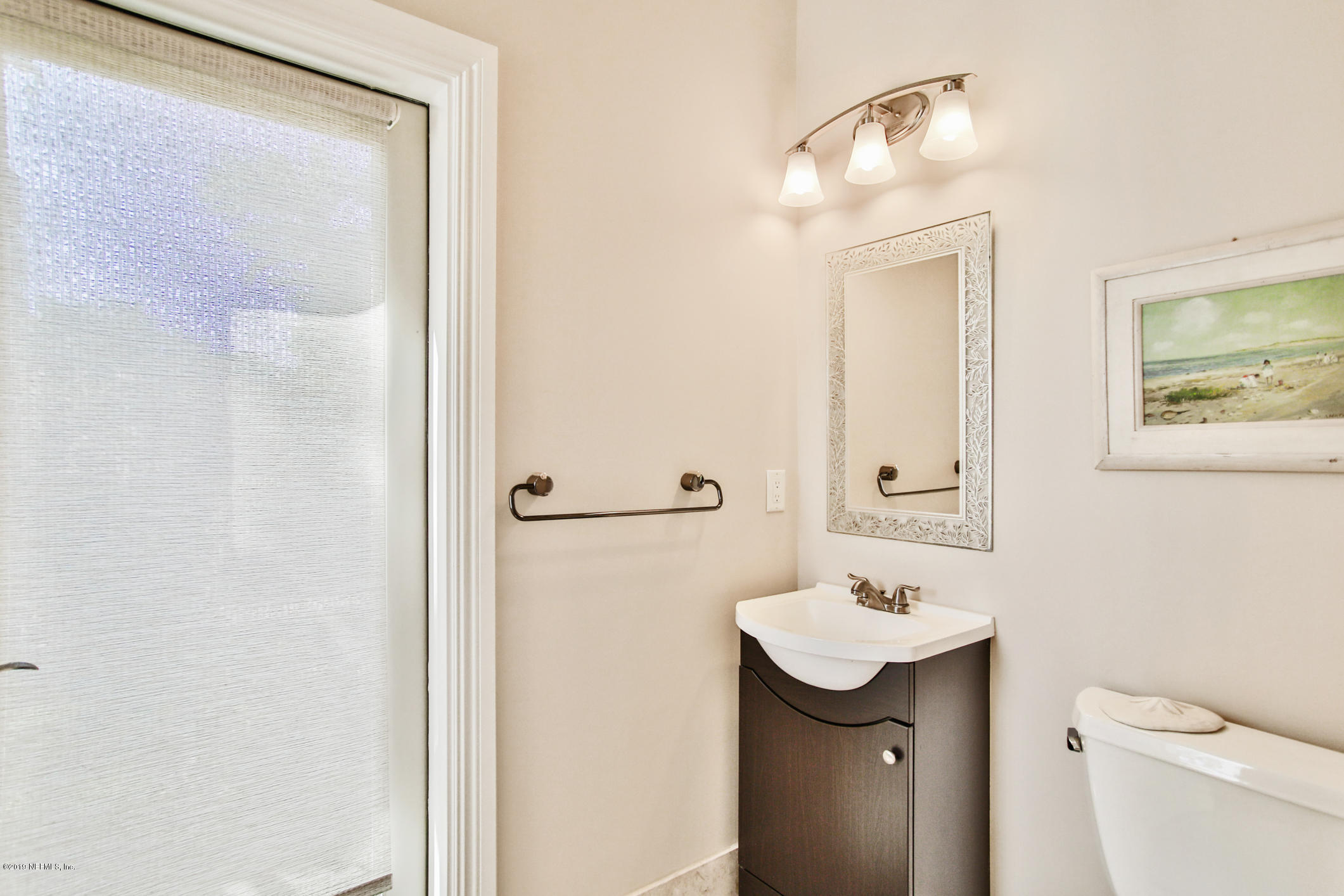 7936 Pine Lake Road Jacksonville, FL 32256 - Photo 36 of 70 a bathroom with a sink a toilet and shower