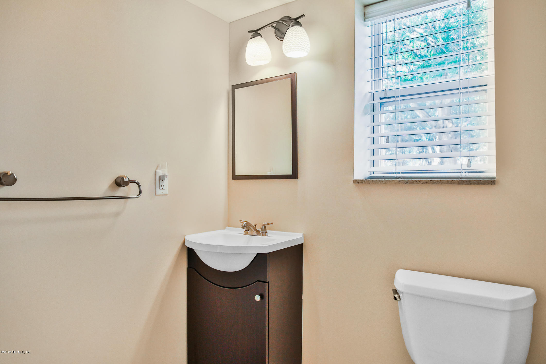 7936 Pine Lake Road Jacksonville, FL 32256 - Photo 41 of 70 a bathroom with a sink and a toilet