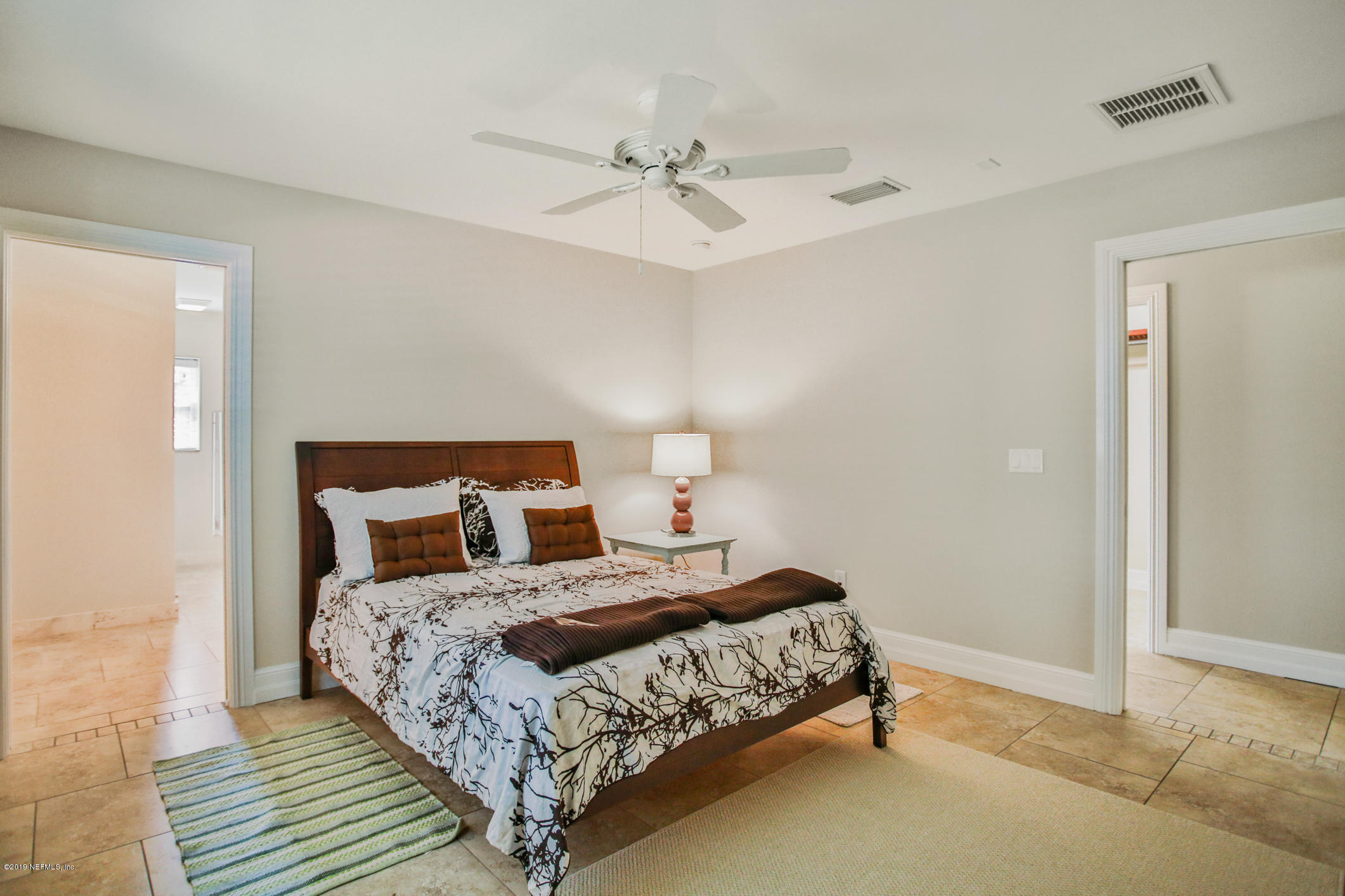 7936 Pine Lake Road Jacksonville, FL 32256 - Photo 42 of 70 a bedroom with a bed and a ceiling fan