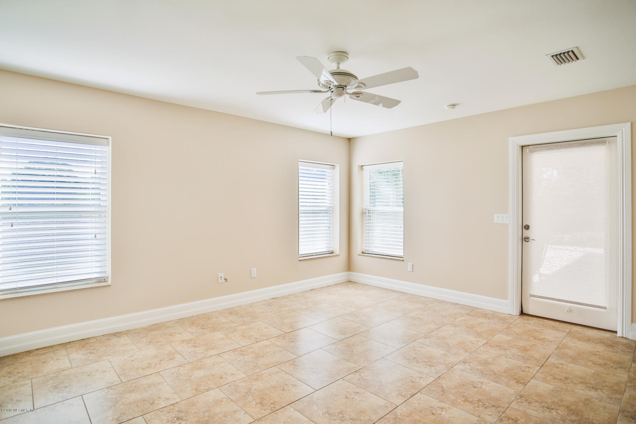 7936 Pine Lake Road Jacksonville, FL 32256 - Photo 47 of 70 a view of an empty room with a window