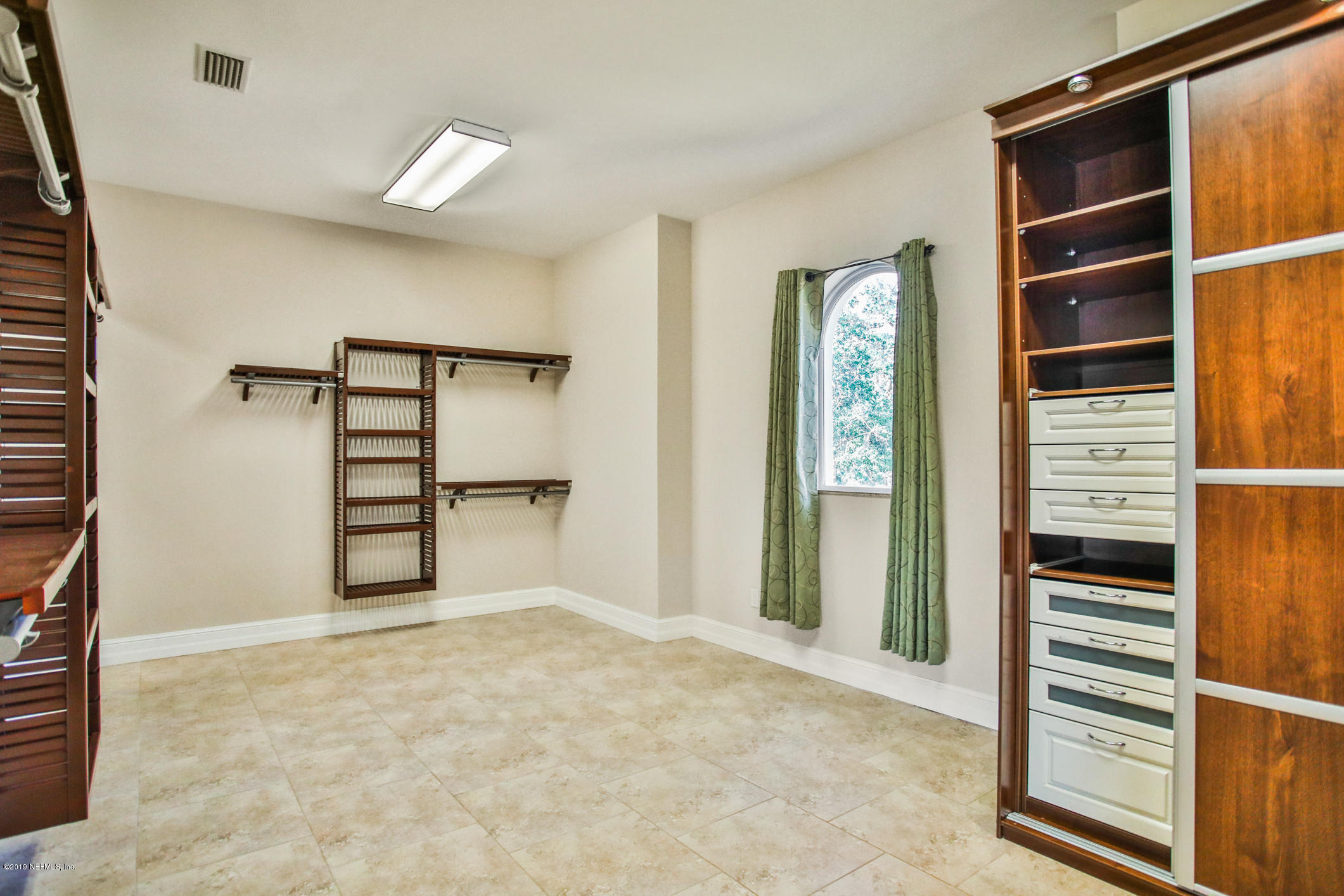 7936 Pine Lake Road Jacksonville, FL 32256 - Photo 58 of 70 a view of wooden floor and windows in a room