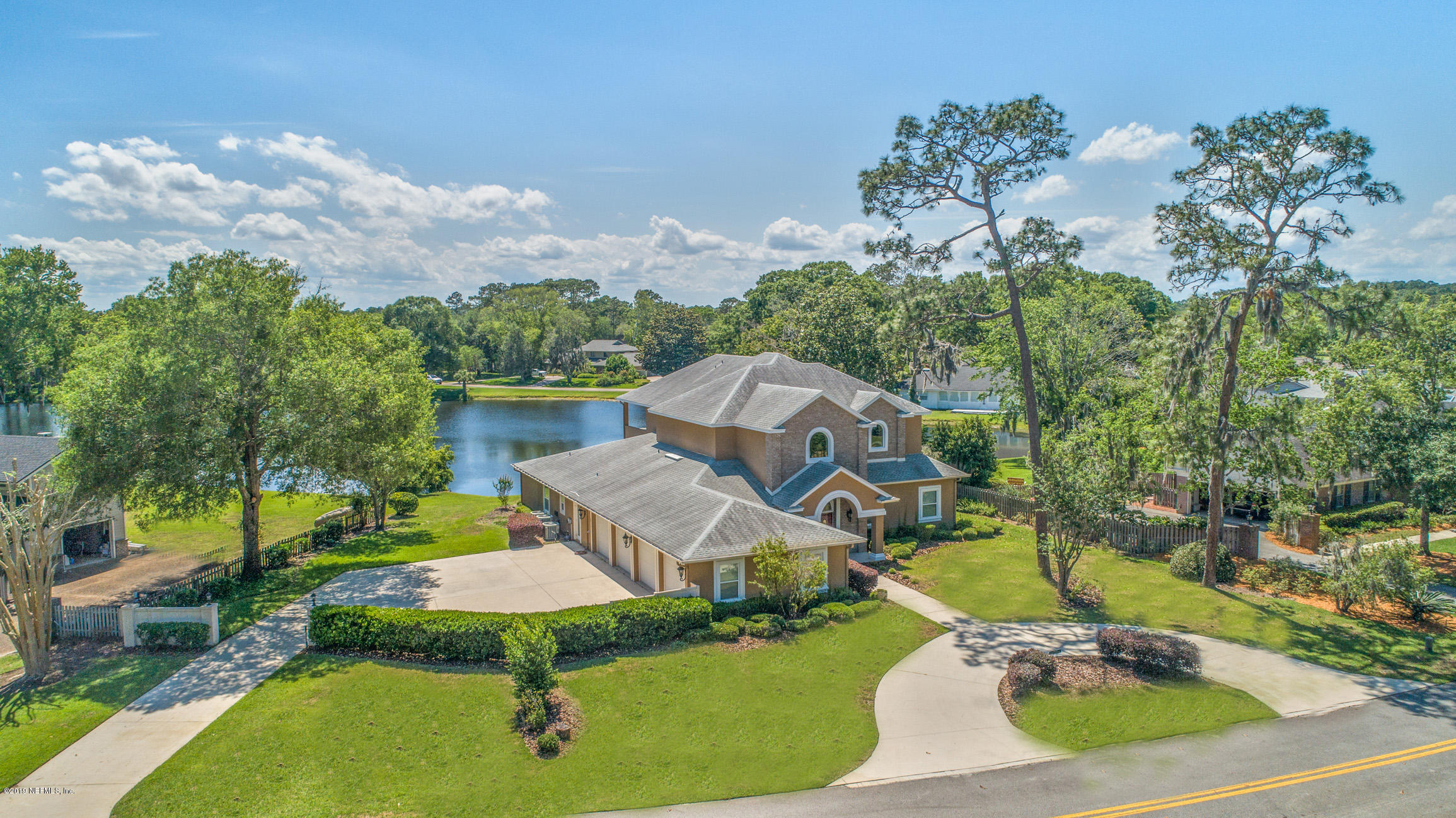 7936 Pine Lake Road Jacksonville, FL 32256 - Photo 6 of 70 an aerial view of a house with swimming pool garden and trees