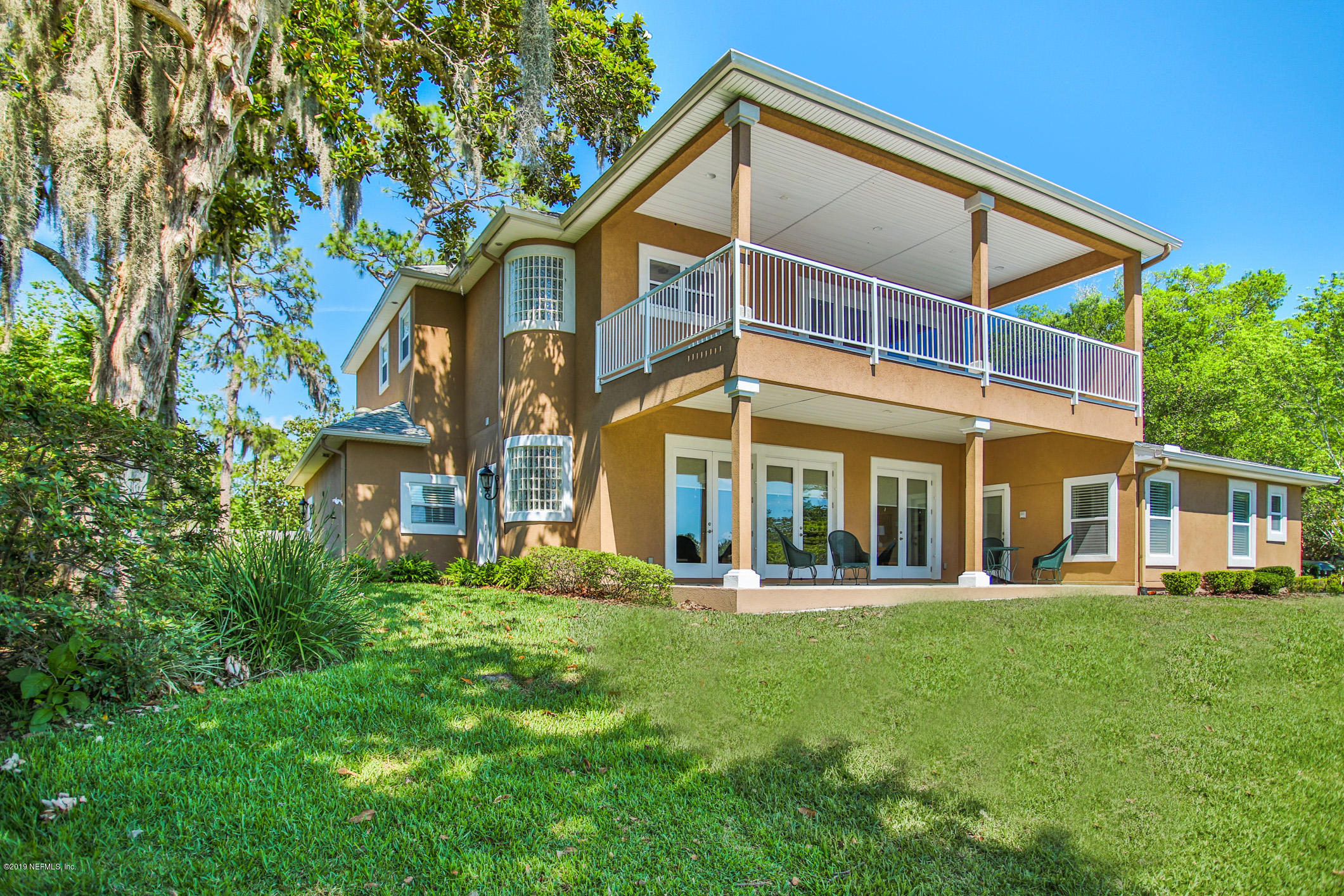 7936 Pine Lake Road Jacksonville, FL 32256 - Photo 61 of 70 a front view of a house with a yard table and chairs