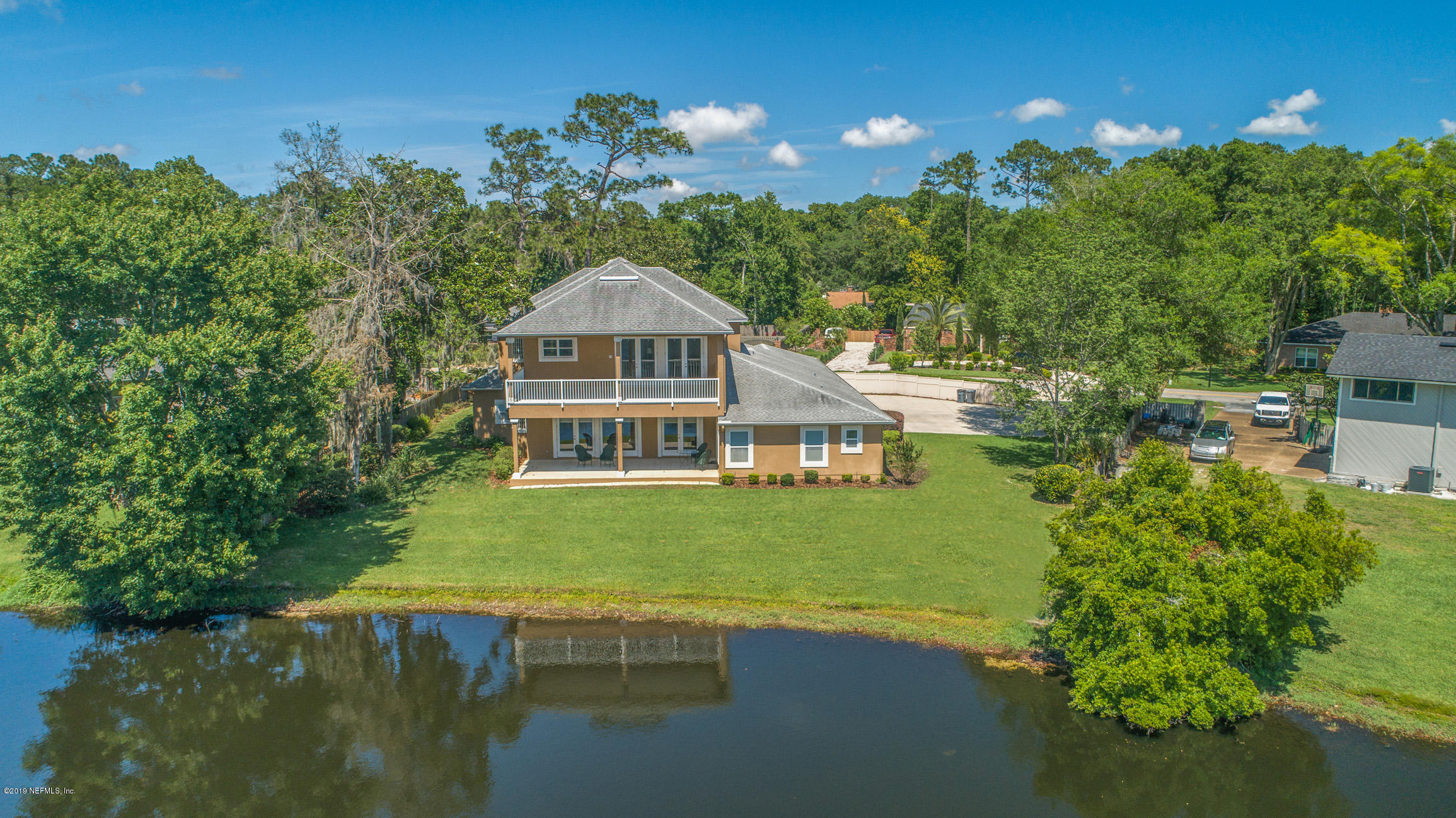 7936 Pine Lake Road Jacksonville, FL 32256 - Photo 63 of 70 a view of a house with a yard next to a house