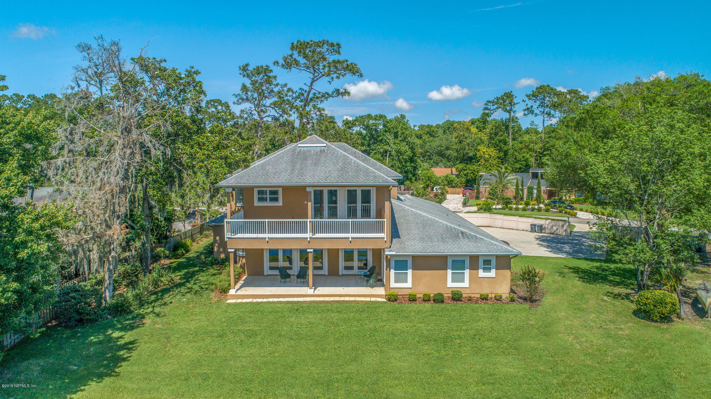 7936 Pine Lake Road Jacksonville, FL 32256 - Photo 64 of 70 a front view of a house with a garden