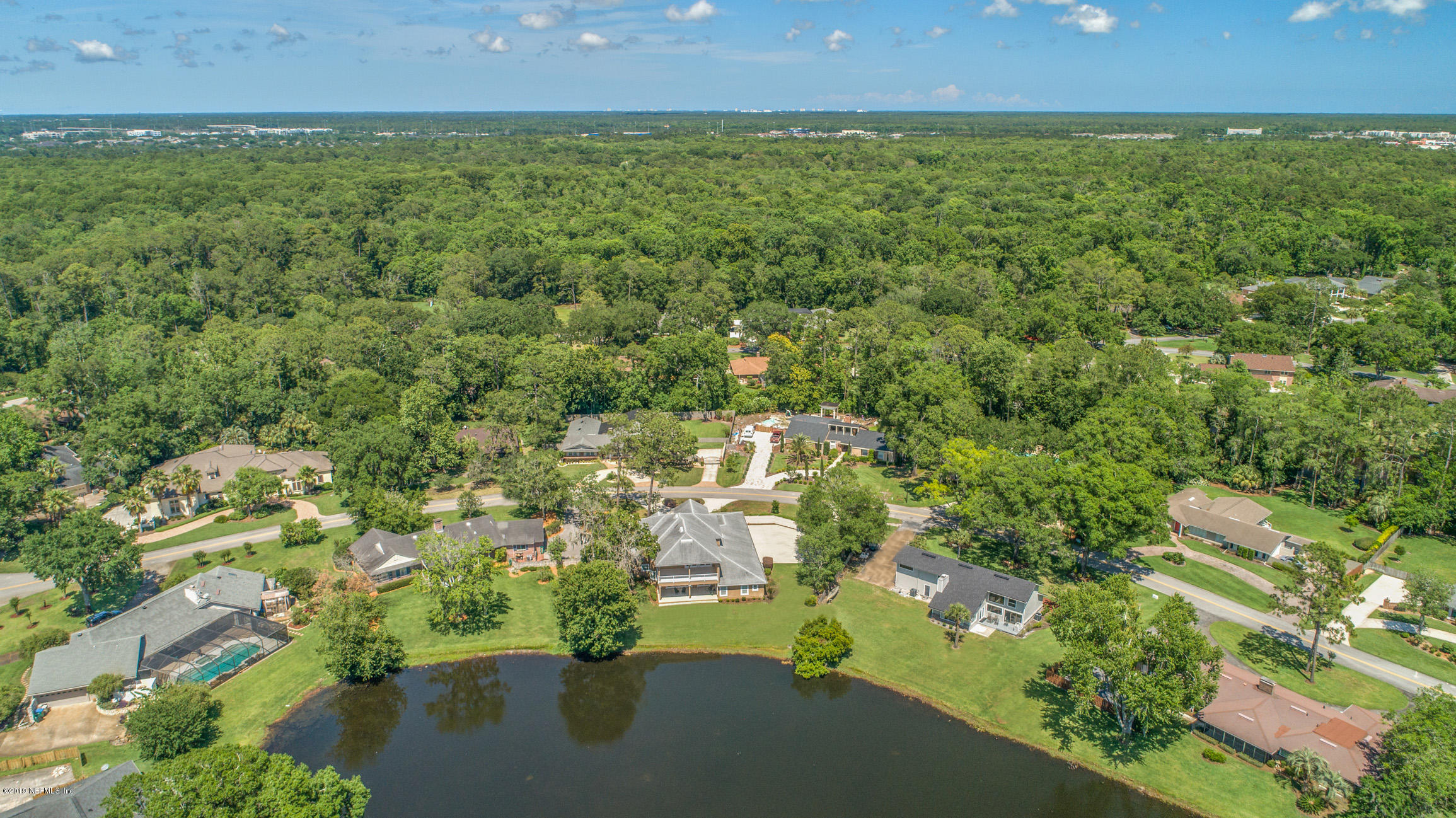 7936 Pine Lake Road Jacksonville, FL 32256 - Photo 66 of 70 an aerial view of residential houses with outdoor space and trees