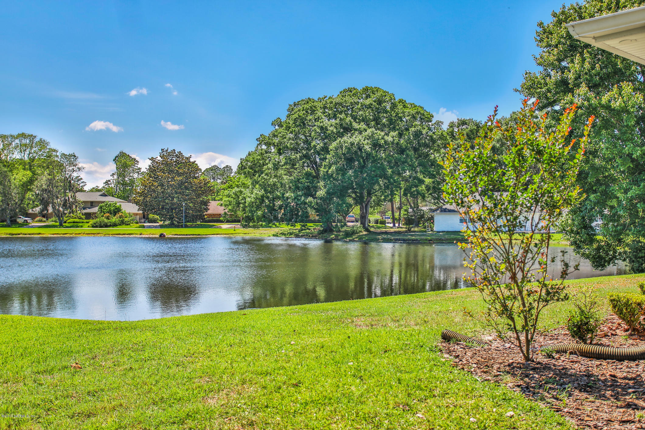 7936 Pine Lake Road Jacksonville, FL 32256 - Photo 68 of 70 a view of a lake with a house in the background