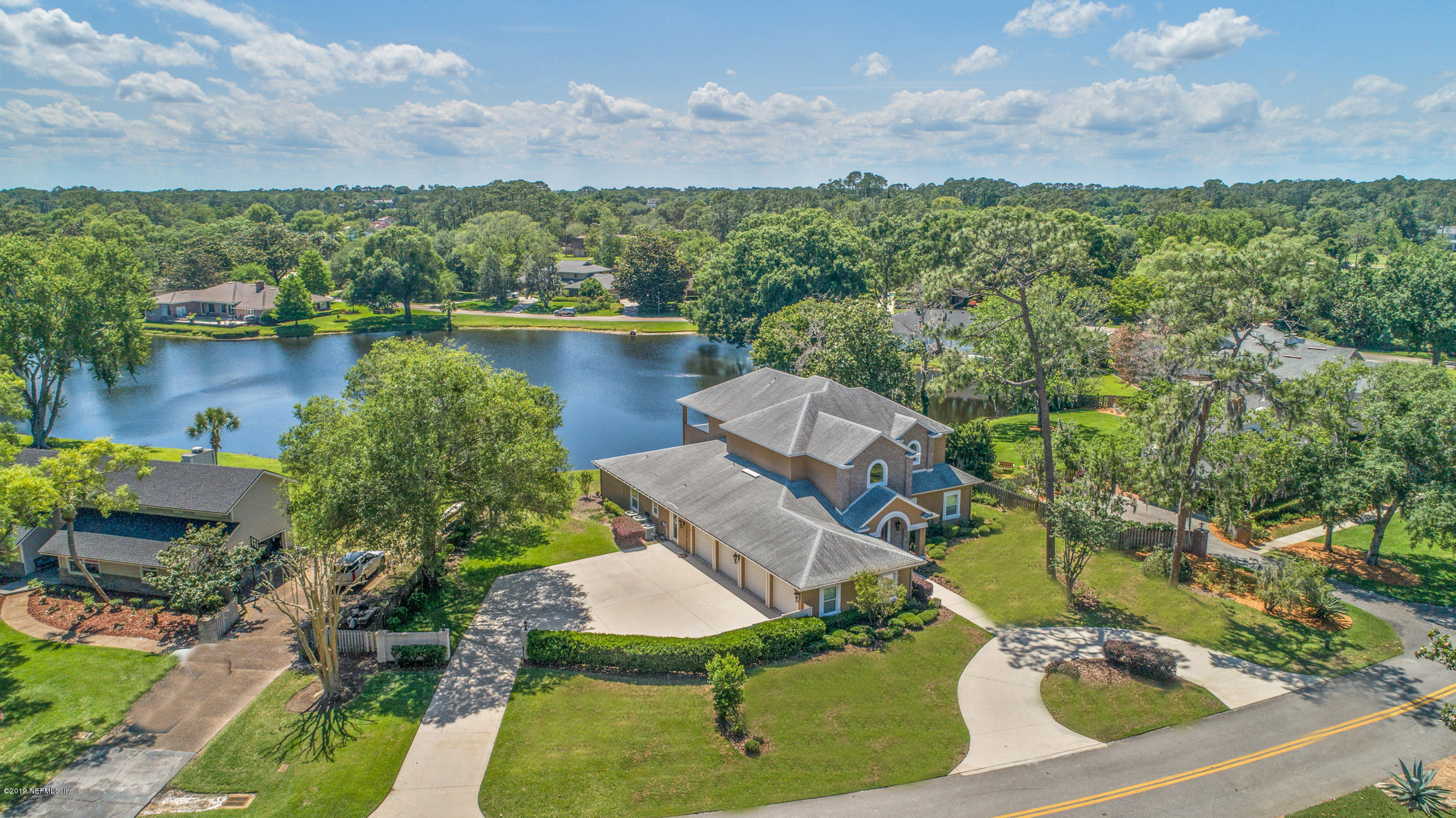 7936 Pine Lake Road Jacksonville, FL 32256 - Photo 7 of 70 an aerial view of a house with a lake view