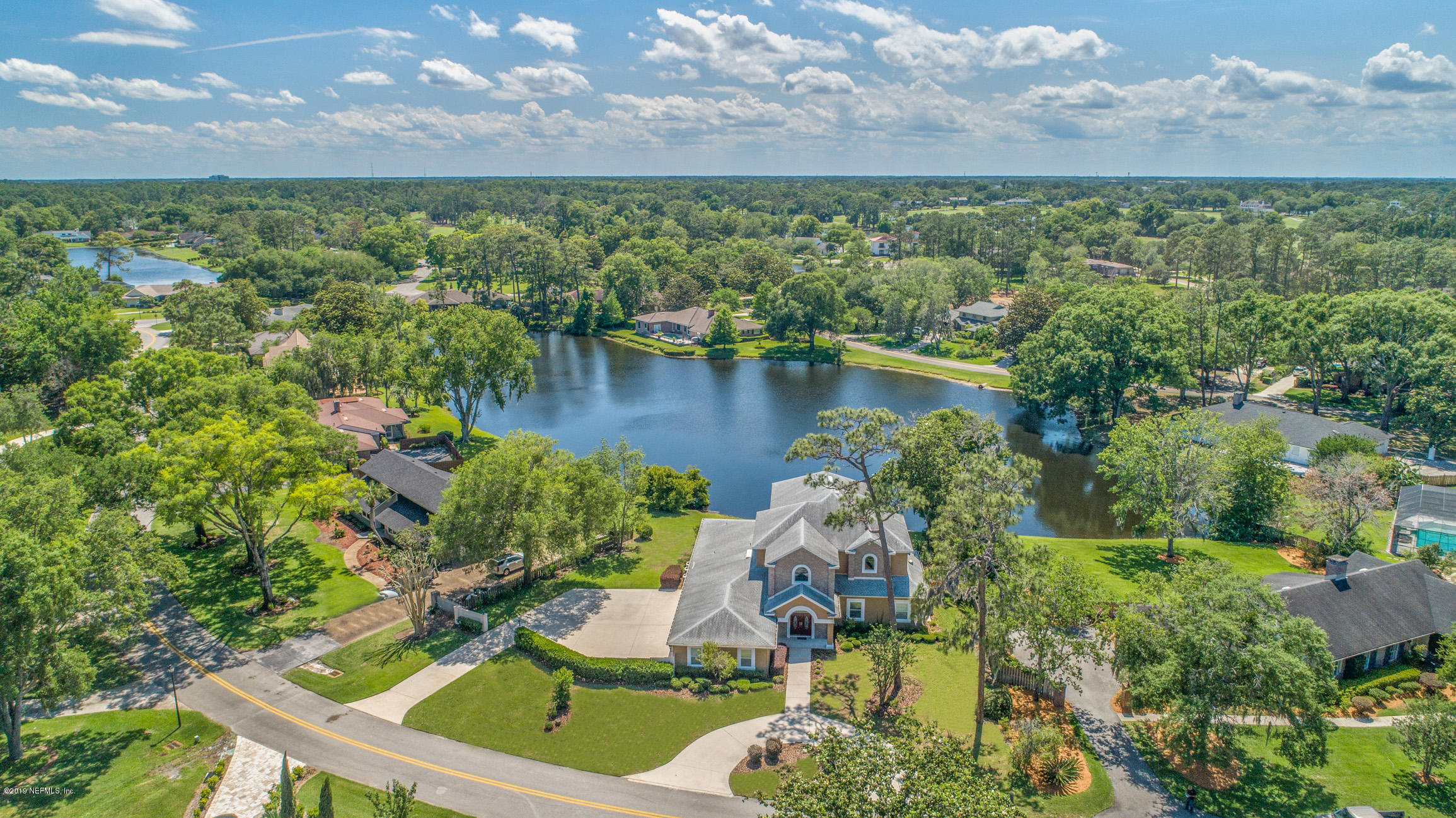 7936 Pine Lake Road Jacksonville, FL 32256 - Photo 8 of 70 a view of a lake in middle of the green
