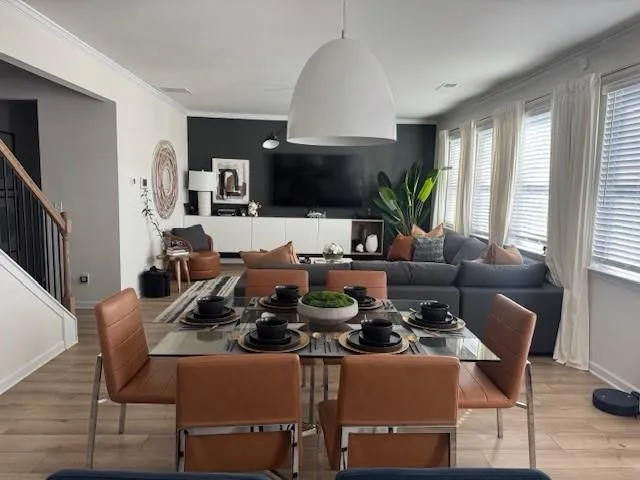 a living room with lots of furniture and a flat screen tv
