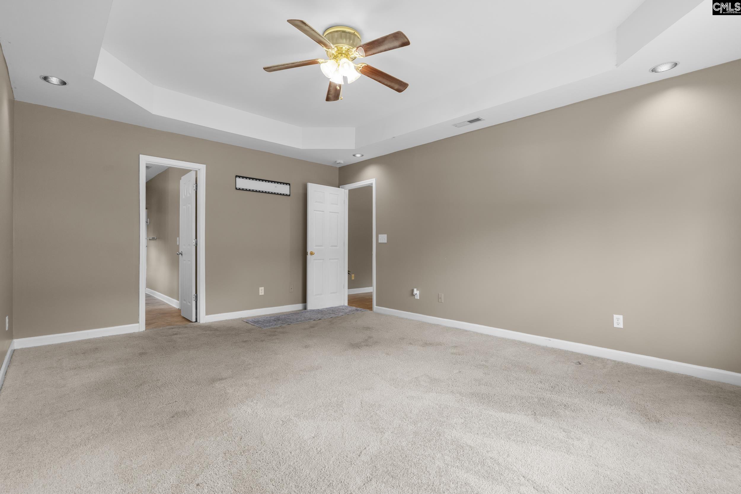 548 Eskie Dixon Road Elgin, SC 29045 - Photo 13 of 27 an empty room with closet and a chandelier fan