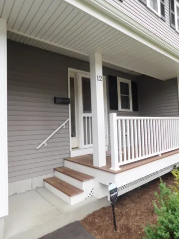 a view of a house with porch and wooden floor