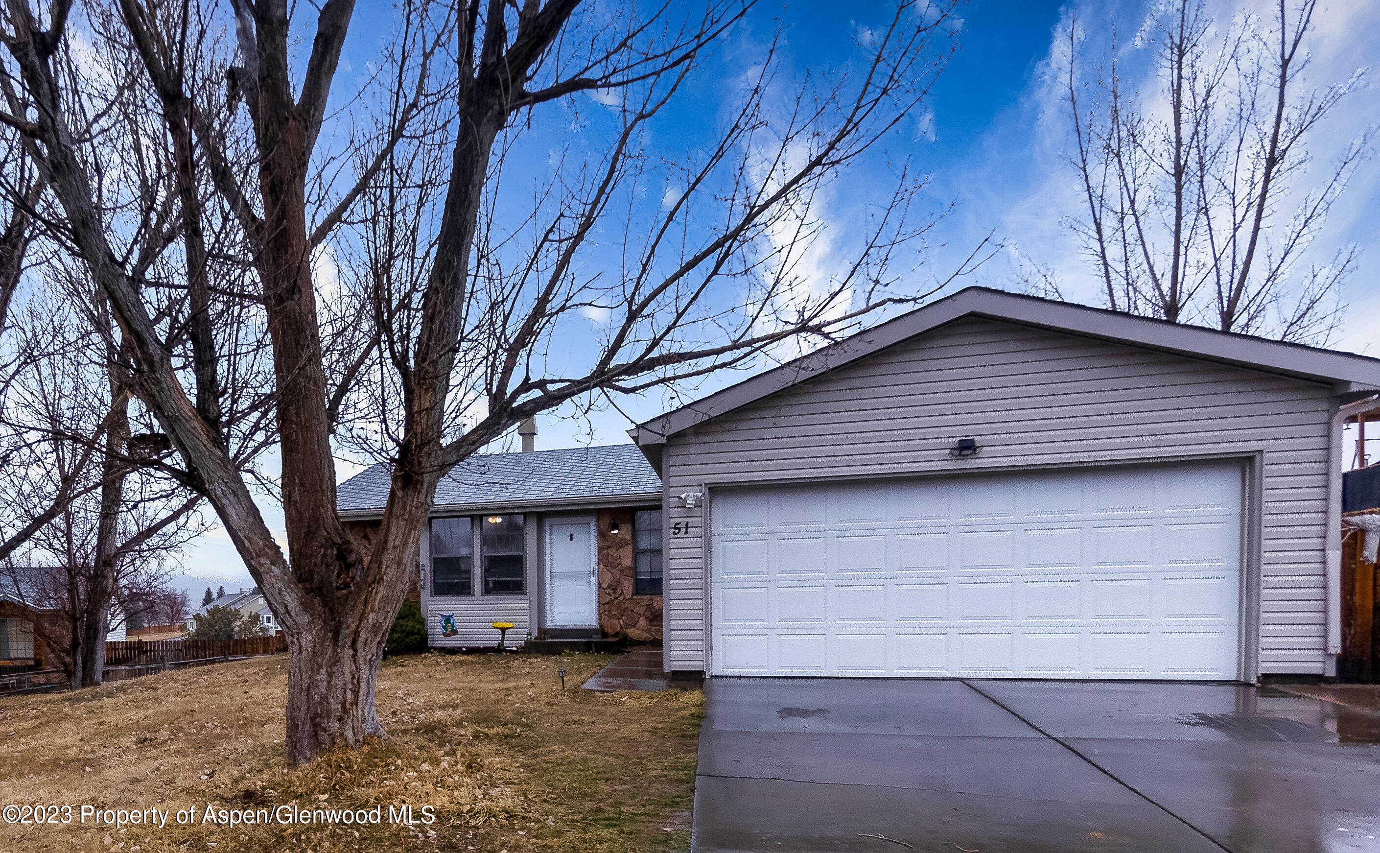51 Hackberry Lane Parachute, CO 81635 - Photo 1 of 17 a house with trees in front of it