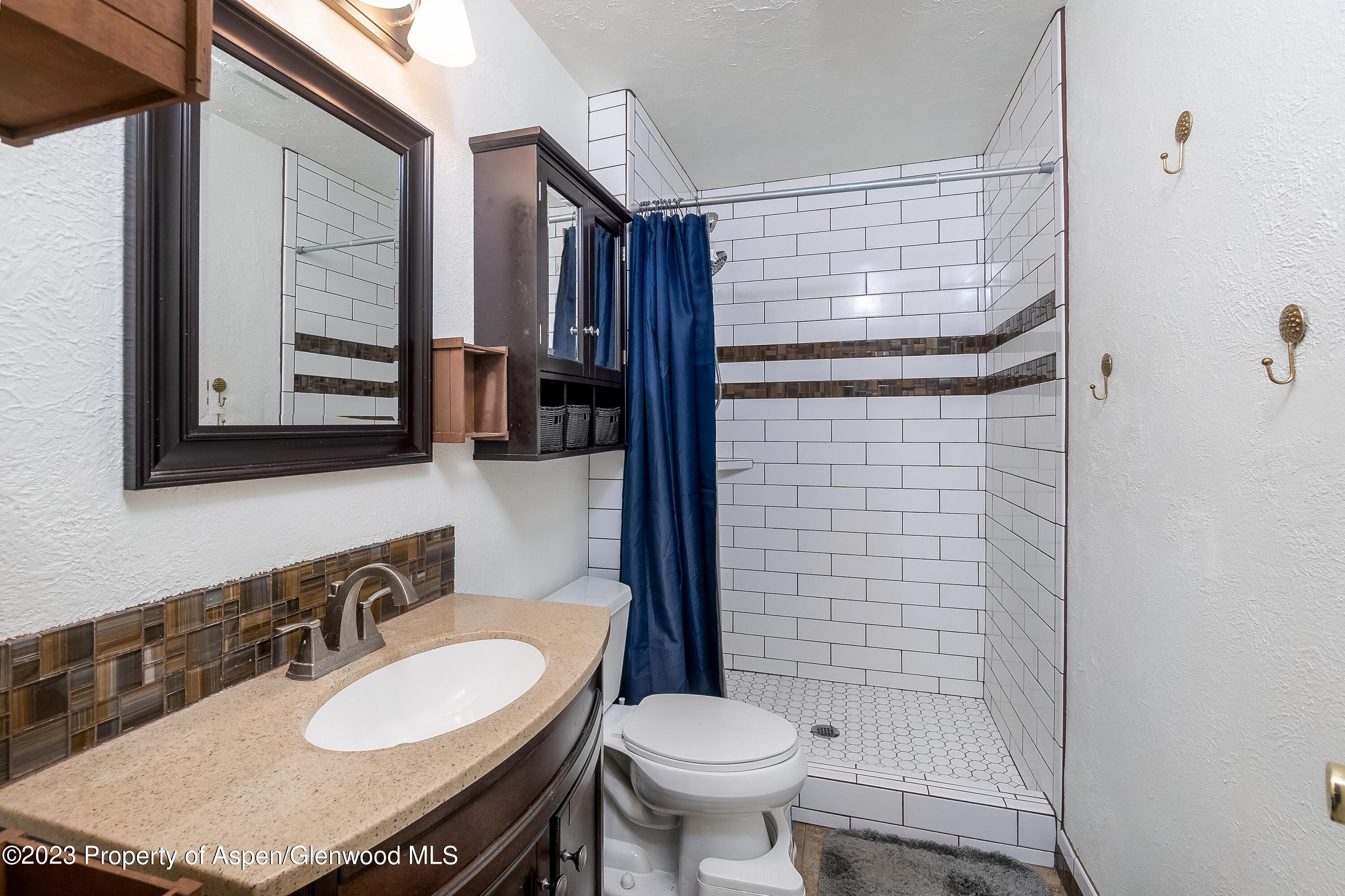 51 Hackberry Lane Parachute, CO 81635 - Photo 16 of 17 a bathroom with a sink toilet and shower