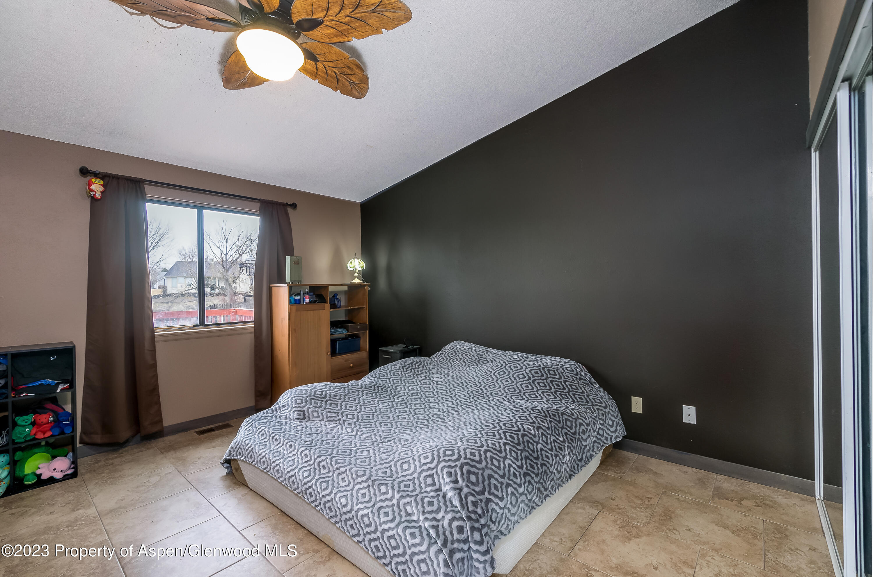51 Hackberry Lane Parachute, CO 81635 - Photo 9 of 17 a bedroom with a bed and window