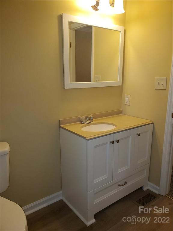 8919 Vicksburg Road Charlotte, NC 28227 - Photo 20 of 22 a bathroom with a sink and a toilet