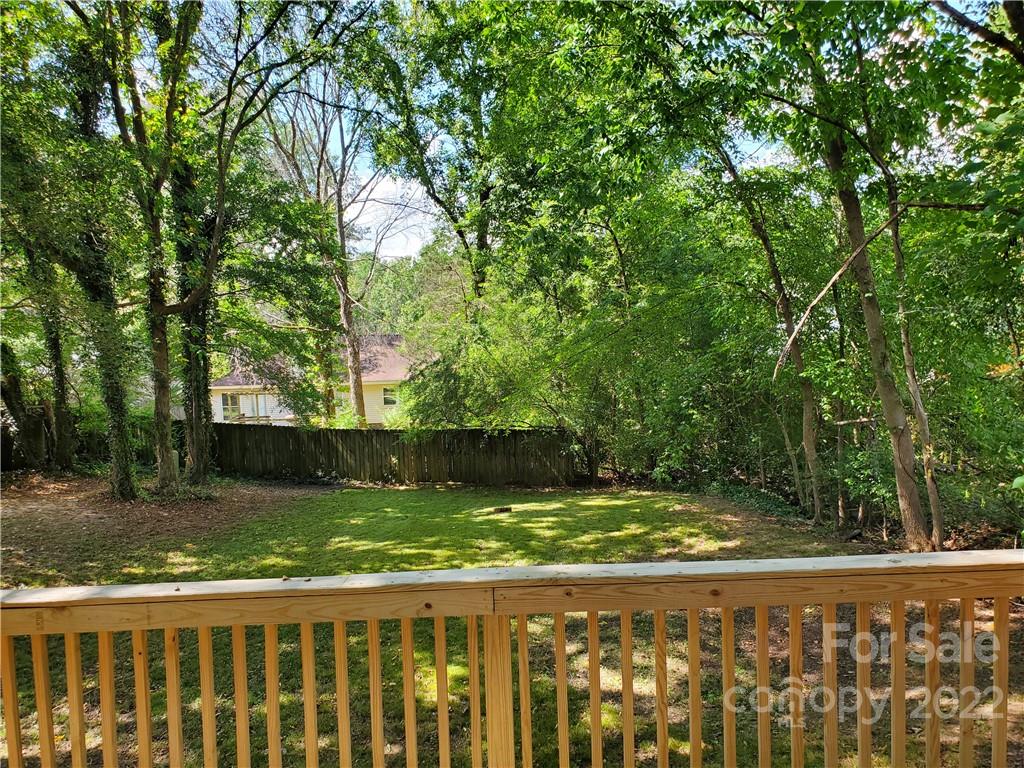 8919 Vicksburg Road Charlotte, NC 28227 - Photo 4 of 22 a view of a yard with large trees