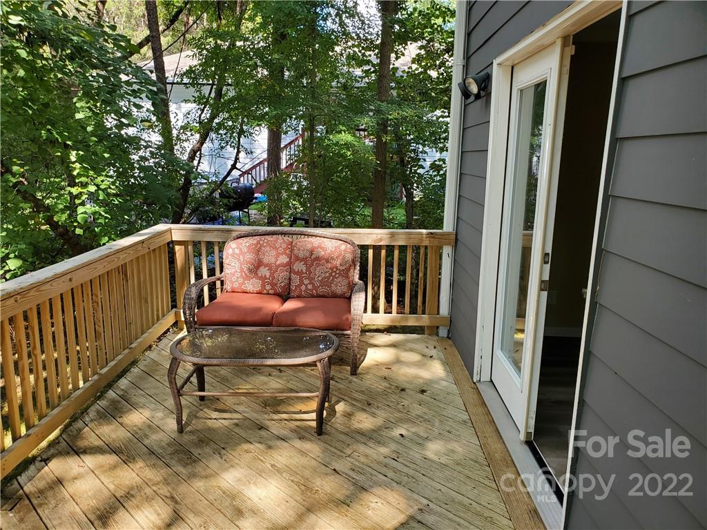 8919 Vicksburg Road Charlotte, NC 28227 - Photo 5 of 22 a view of balcony with wooden floor and outdoor seating