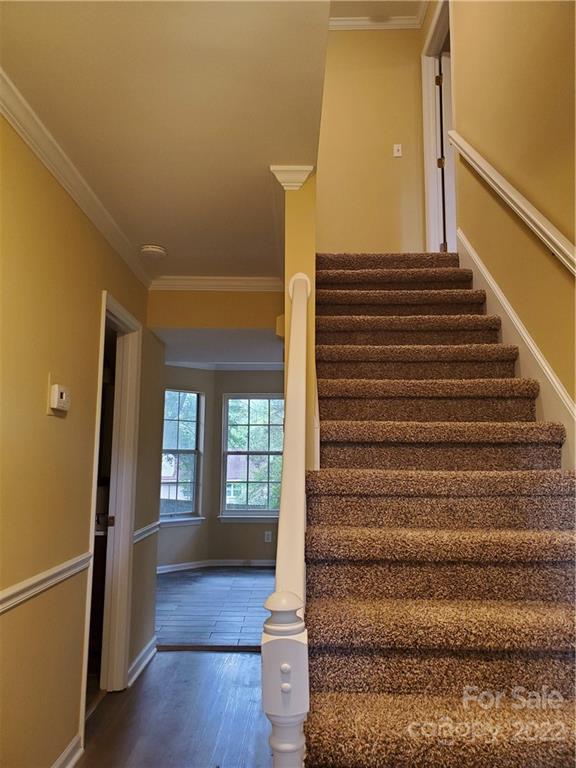 8919 Vicksburg Road Charlotte, NC 28227 - Photo 6 of 22 a view of entryway and hall with wooden floor