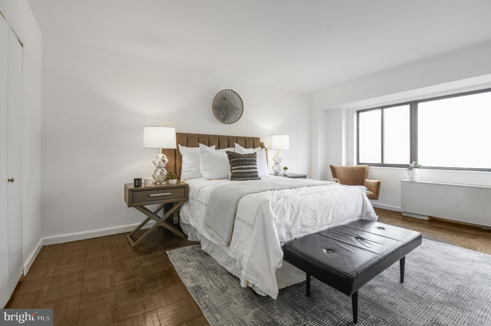 3701 Connecticut Avenue Northwest, Unit 236 Washington, DC 20008 - Photo 13 of 19 a bedroom with a bed and a window