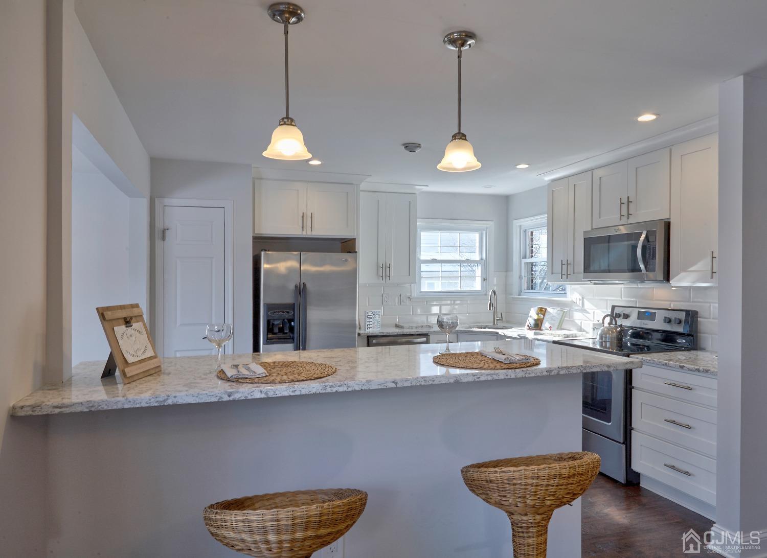 5 Cottingham Drive Monroe Township, NJ 08831 - Photo 12 of 19 a kitchen with a center island and cabinets