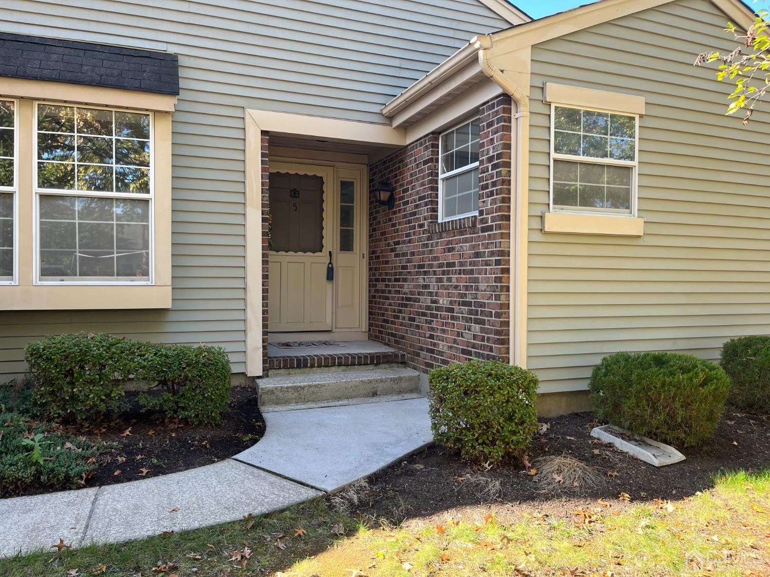 5 Cottingham Drive Monroe Township, NJ 08831 - Photo 18 of 19 a front view of a house with a yard