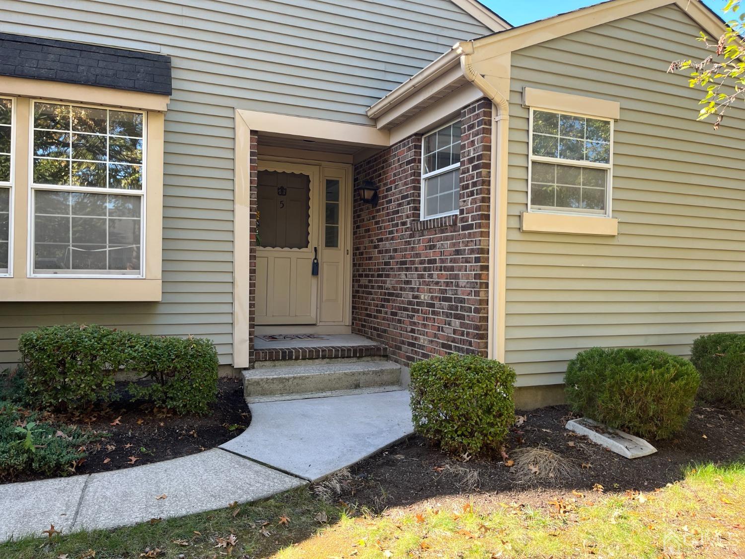 5 Cottingham Drive Monroe Township, NJ 08831 - Photo 2 of 19 a front view of a house with a yard