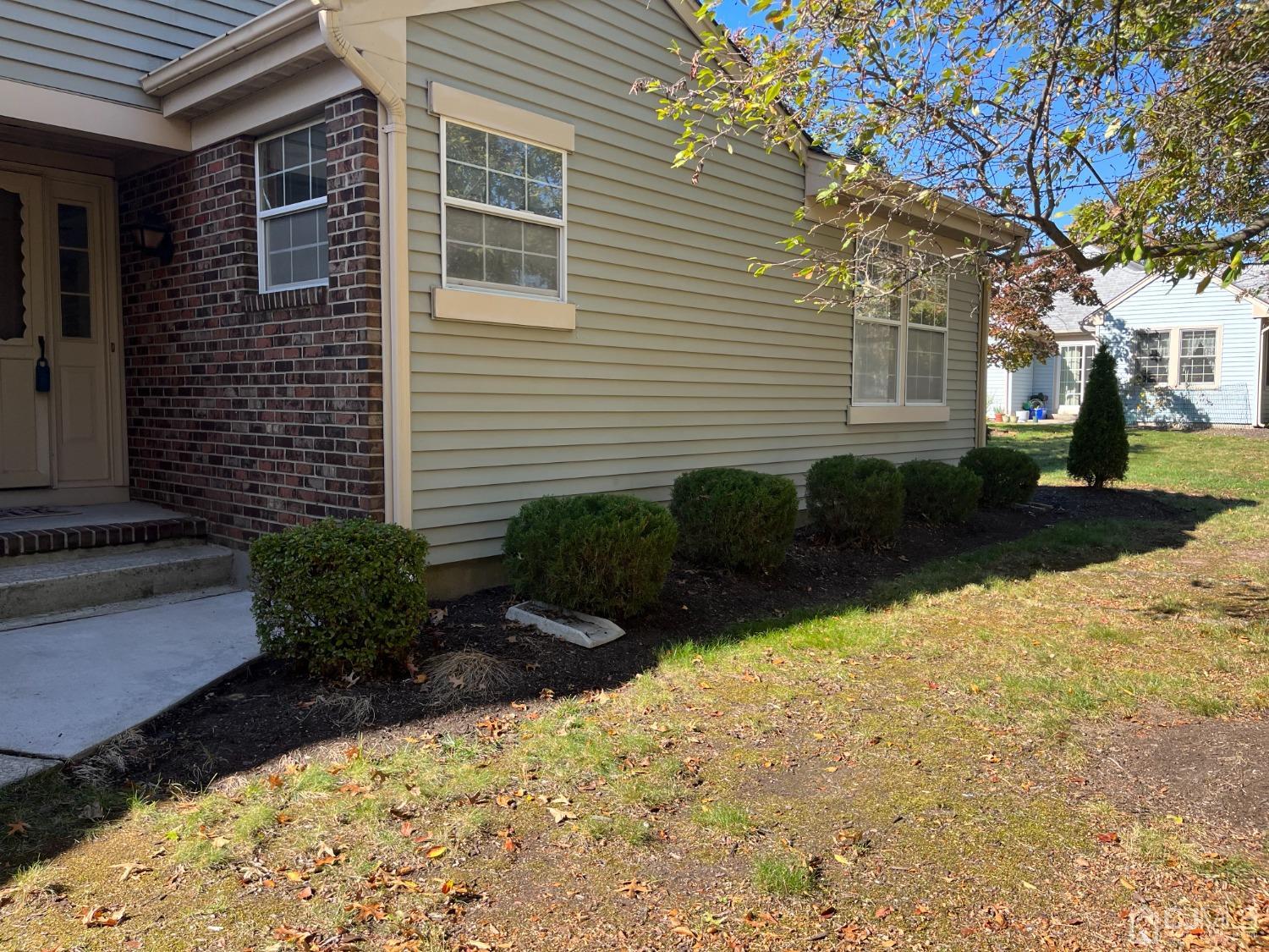 5 Cottingham Drive Monroe Township, NJ 08831 - Photo 4 of 19 a view of a backyard with plants and large tree
