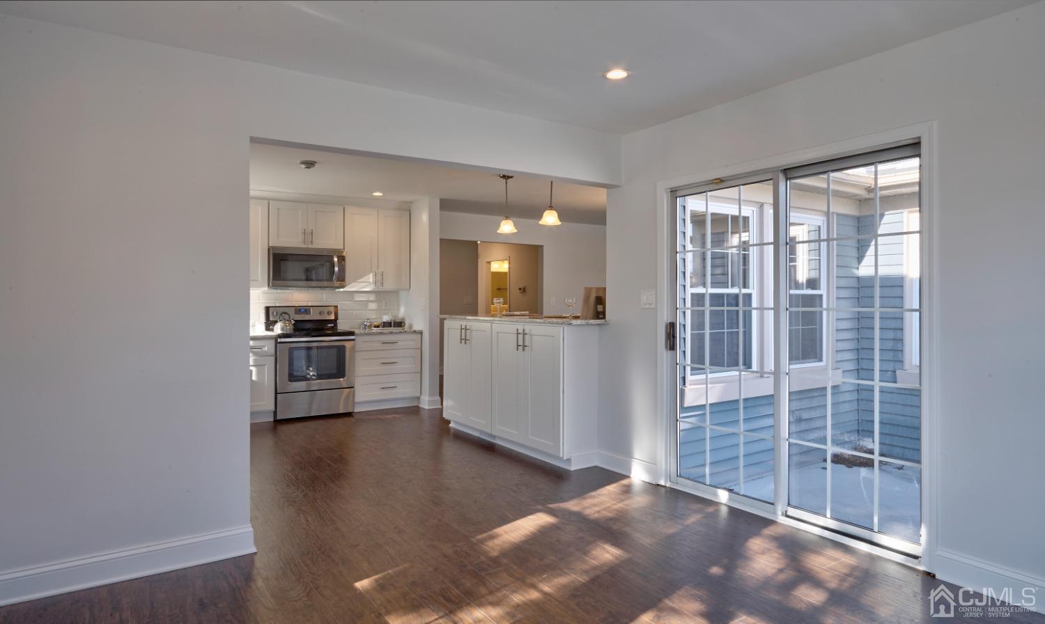 5 Cottingham Drive Monroe Township, NJ 08831 - Photo 10 of 19 a view of a kitchen with a sink and cabinets