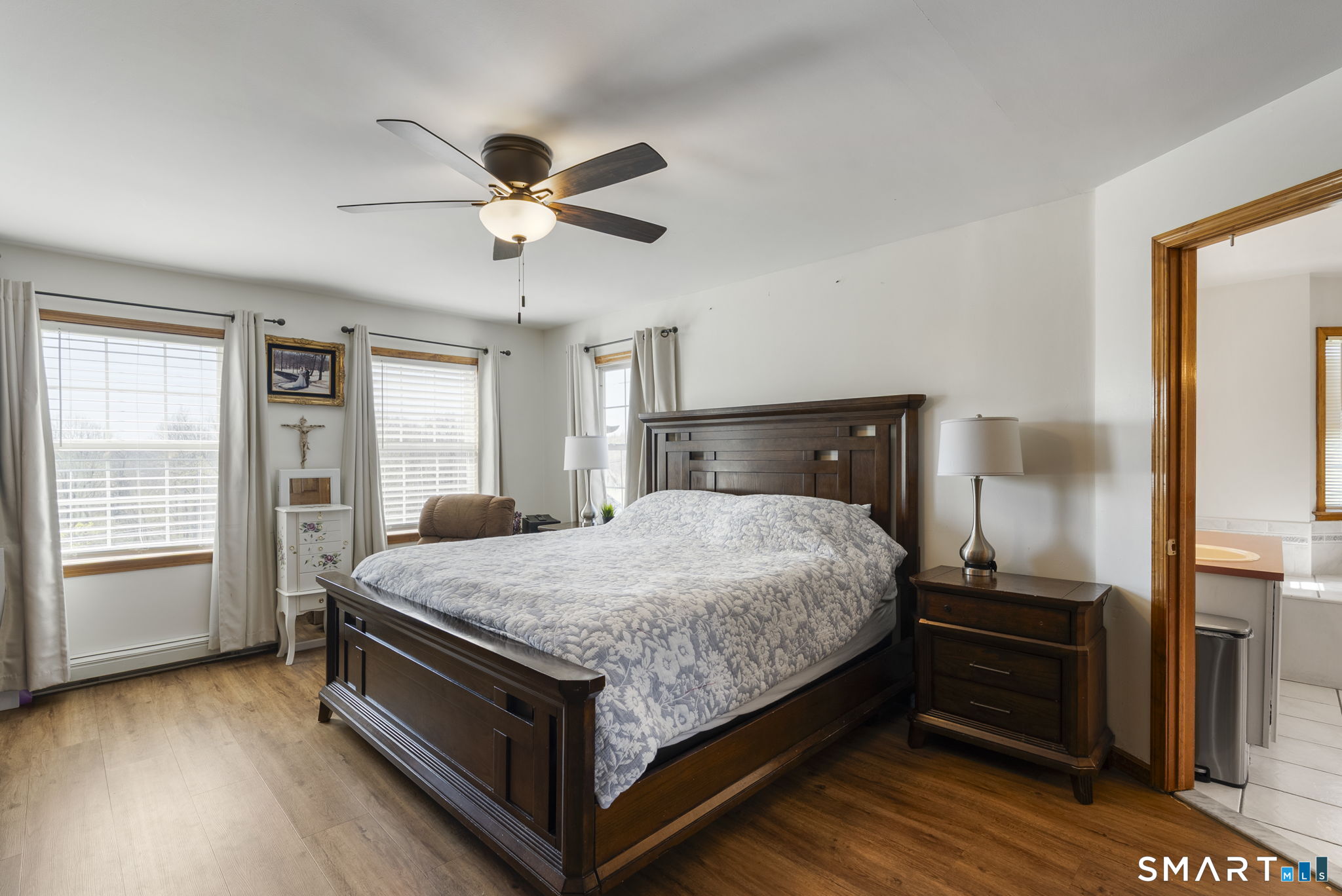341 High Street Extension Thomaston, CT 06787 - Photo 16 of 39 a bedroom with a bed and wooden floor