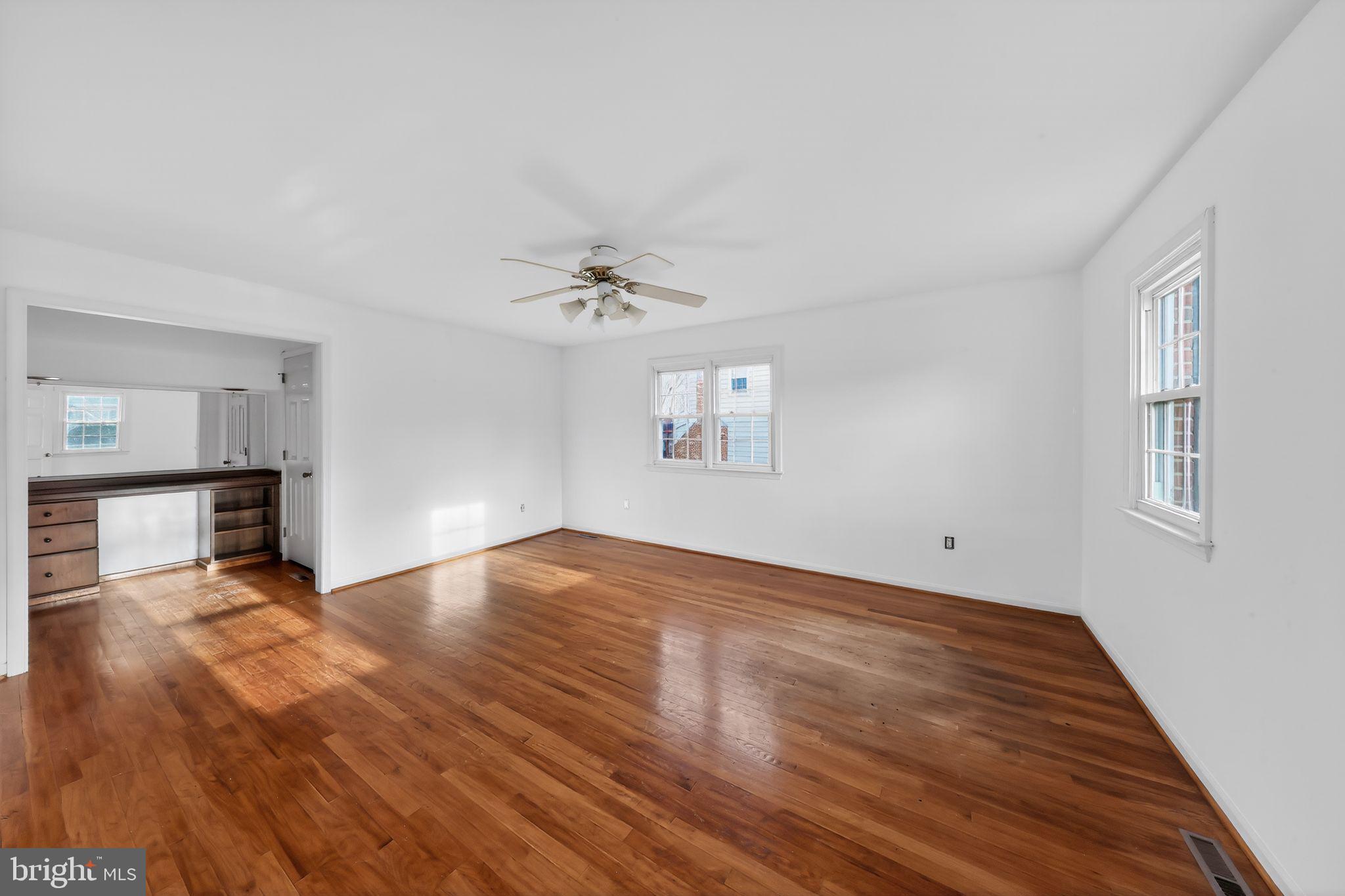 6 Kings Grant Road Hockessin, DE 19707 - Photo 12 of 24 a view of empty room with wooden floor and fan