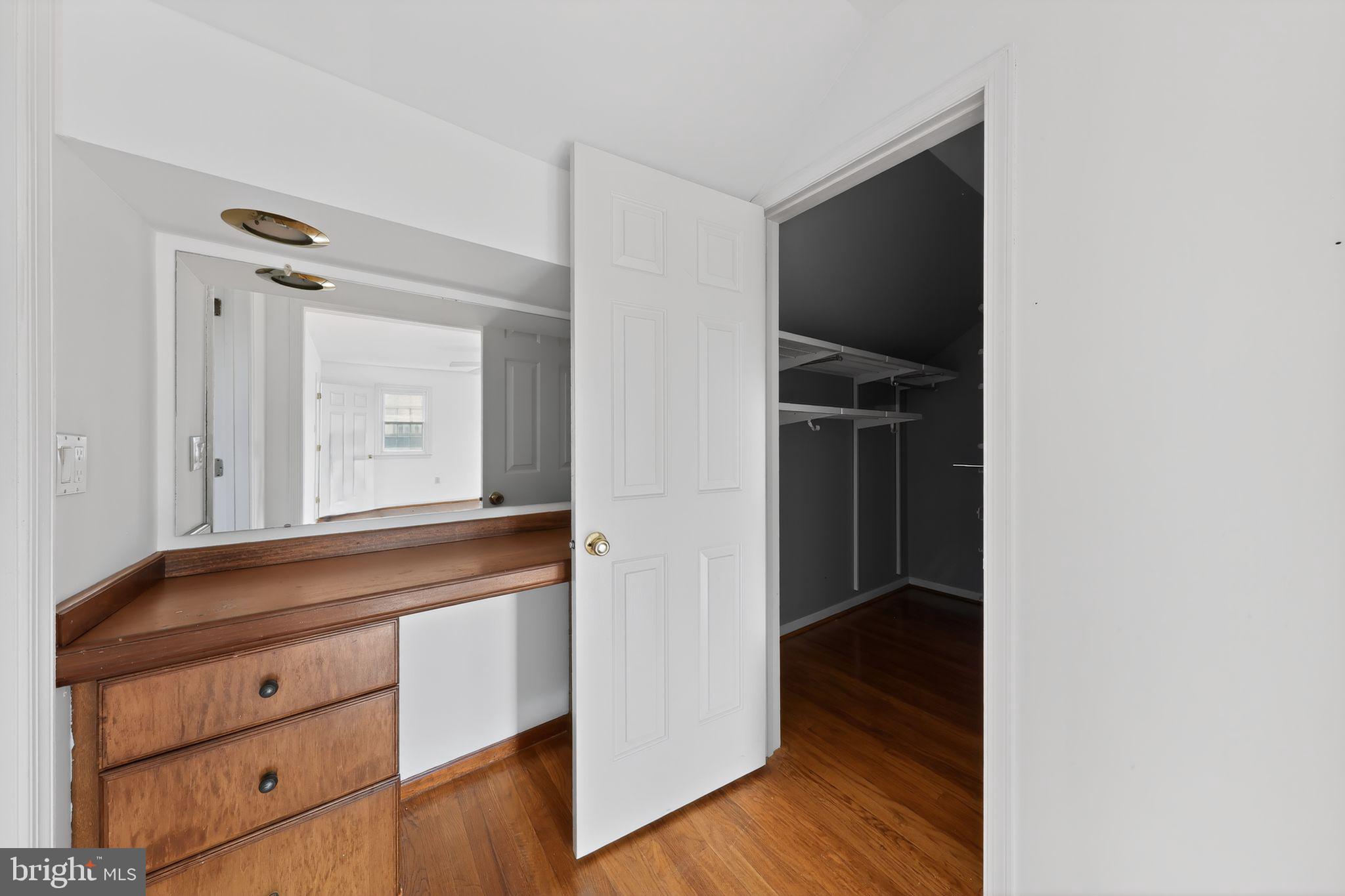 6 Kings Grant Road Hockessin, DE 19707 - Photo 15 of 24 a view of walk in closet with wooden floor