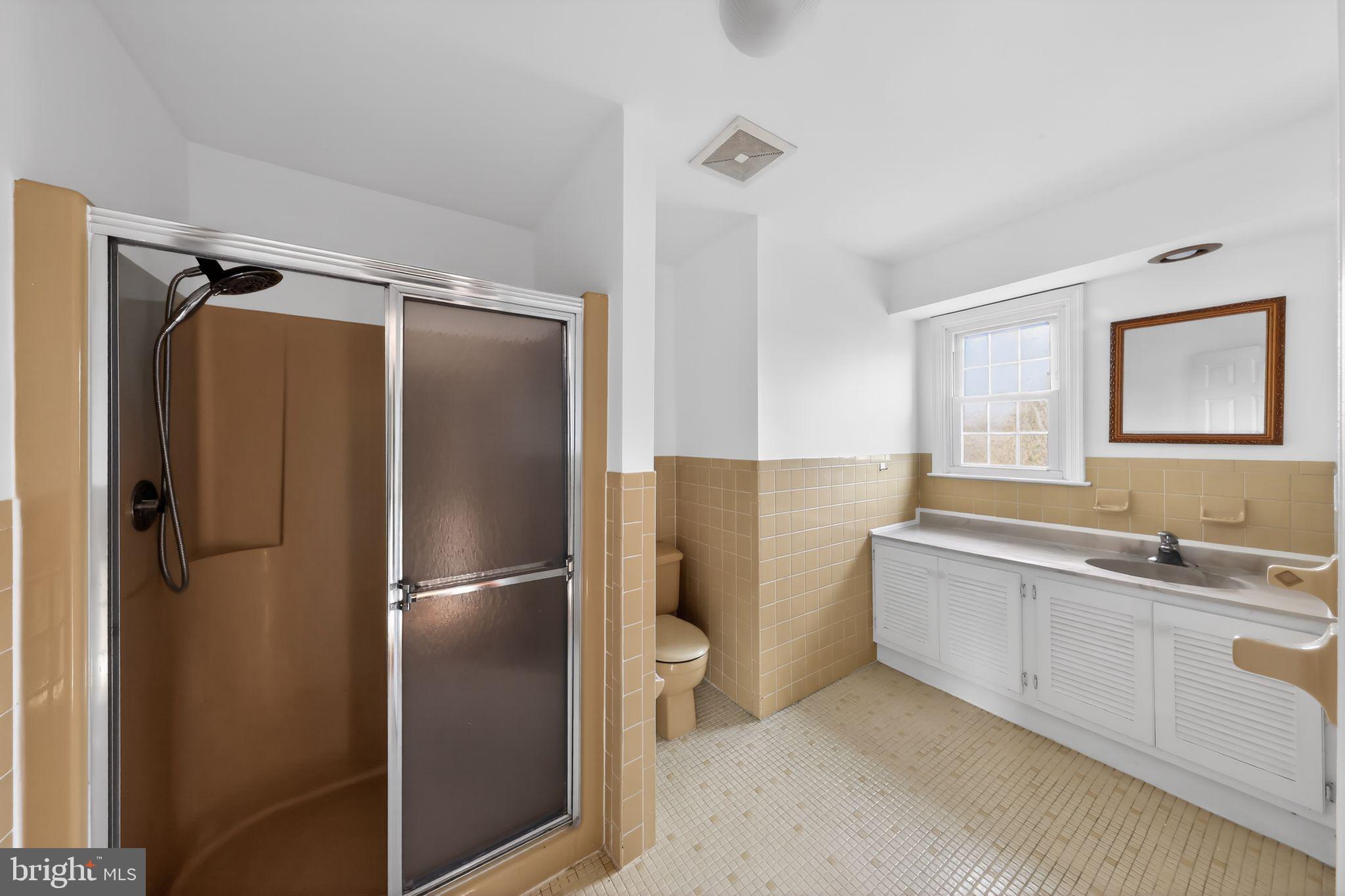 6 Kings Grant Road Hockessin, DE 19707 - Photo 16 of 24 a bathroom with a double vanity sink toilet and shower