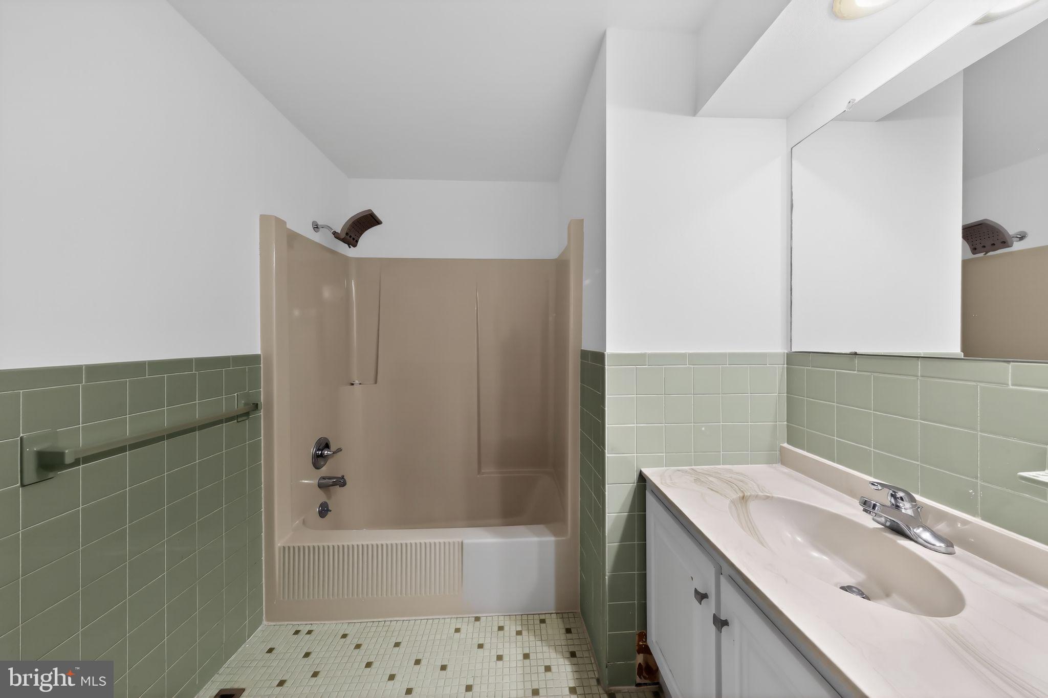 6 Kings Grant Road Hockessin, DE 19707 - Photo 20 of 24 a bathroom with a sink mirror toilet and bathtub