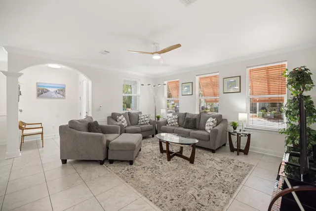a bathroom with a granite countertop sink toilet mirror and shower