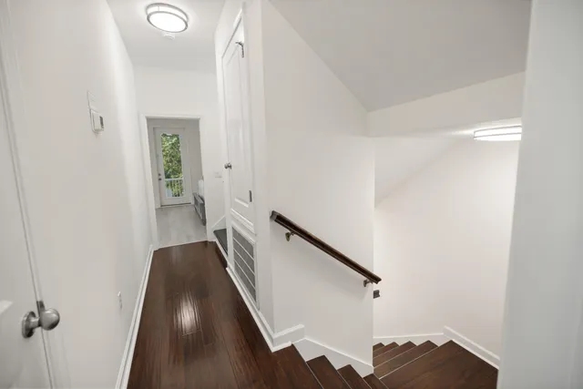 a bedroom with a flat screen television and a bed