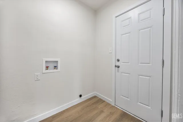 an empty room with wooden floor