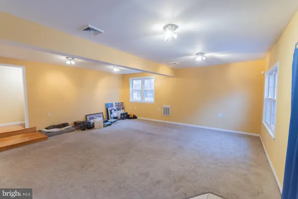 a view of a swimming pool and trees in the background
