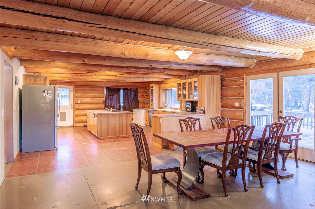 345 Seylor Valley Road Inchelium, WA 99138 - Photo 4 of 28 a view of a dining room with furniture window and wooden floor