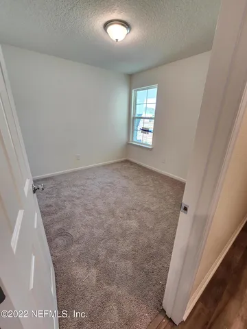 a bathroom with a double vanity sink toilet and shower