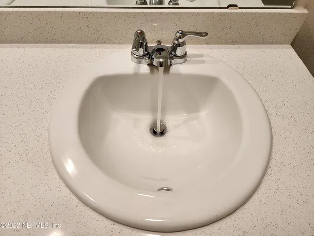 a view of kitchen and refrigerator in a room