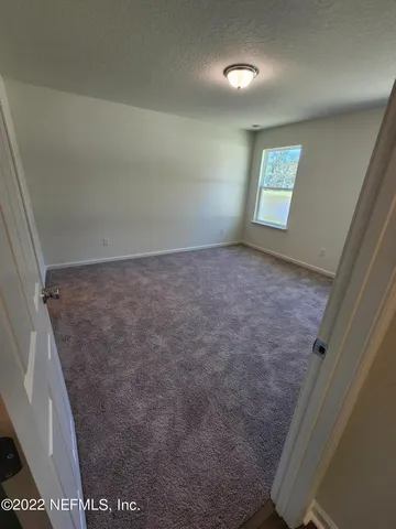 a bathroom with a double vanity sink toilet and mirror