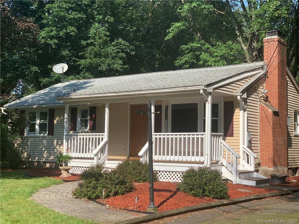 a front view of a house with a porch