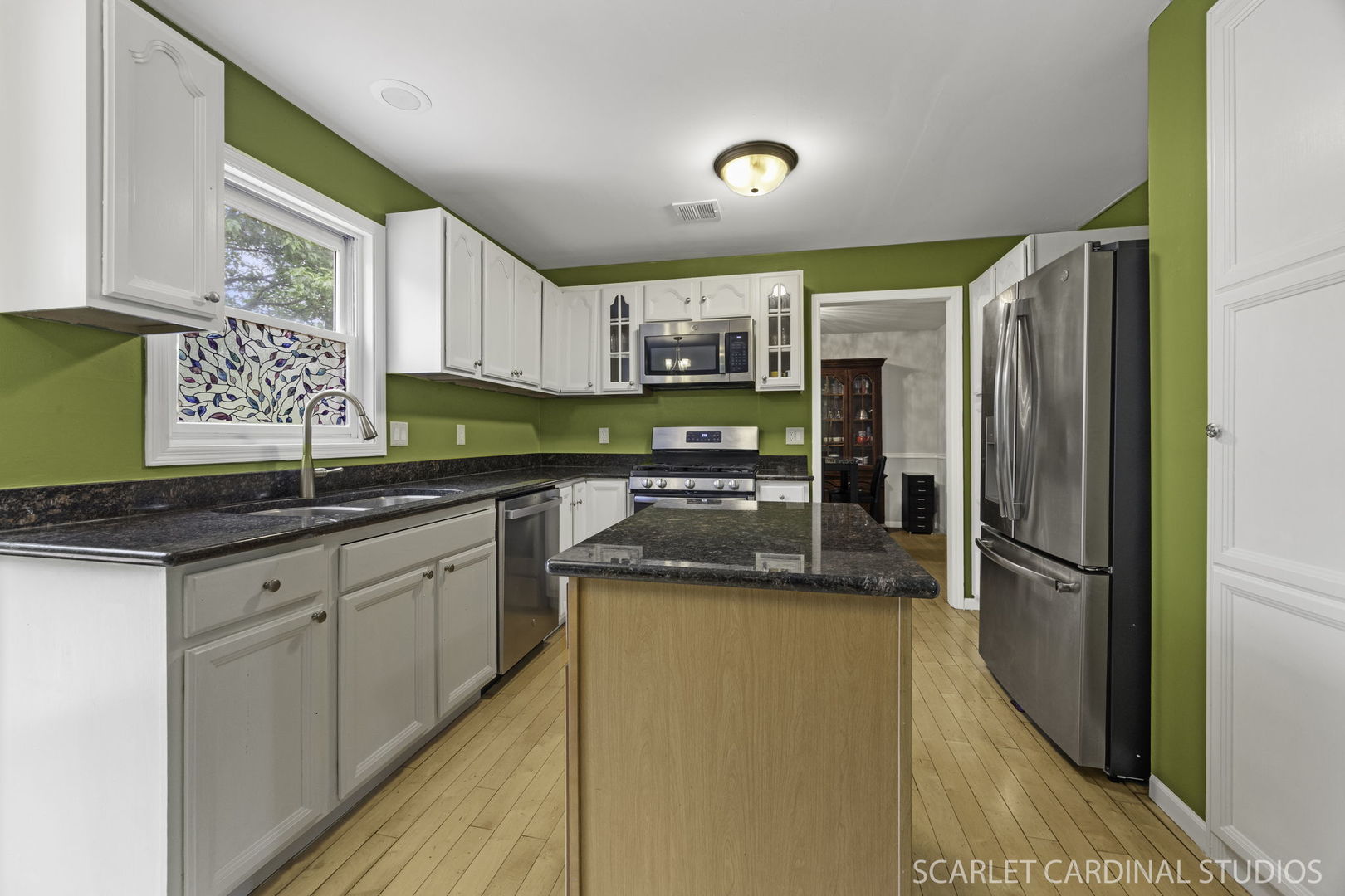 3100 Compton Road Aurora, IL 60504 - Photo 11 of 27 a kitchen with a sink a refrigerator and cabinets