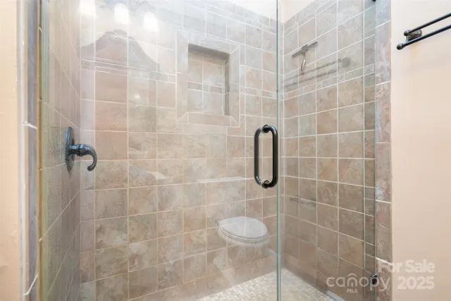 a bed room with a bed and a potted plant